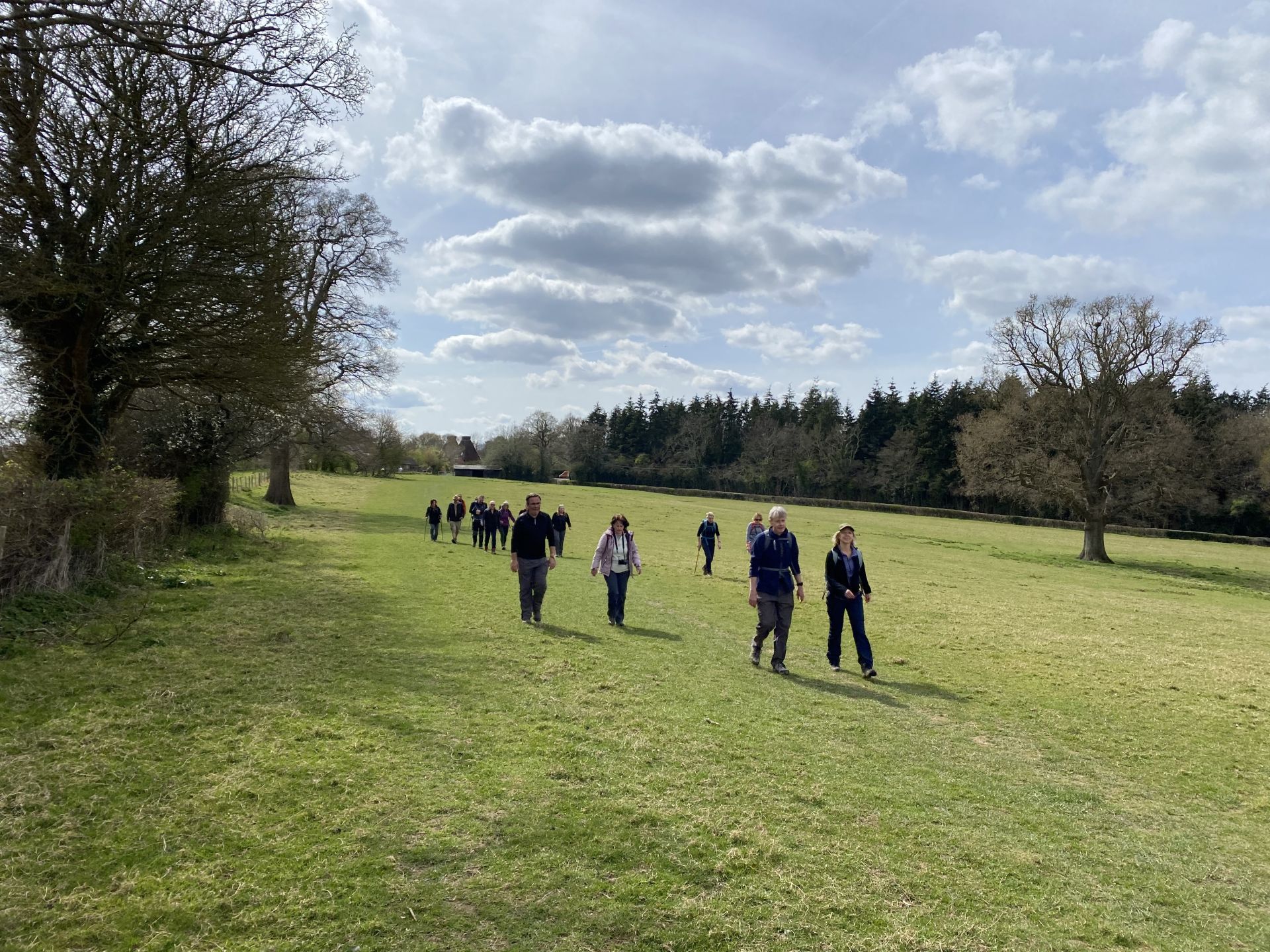 people walking down a valley